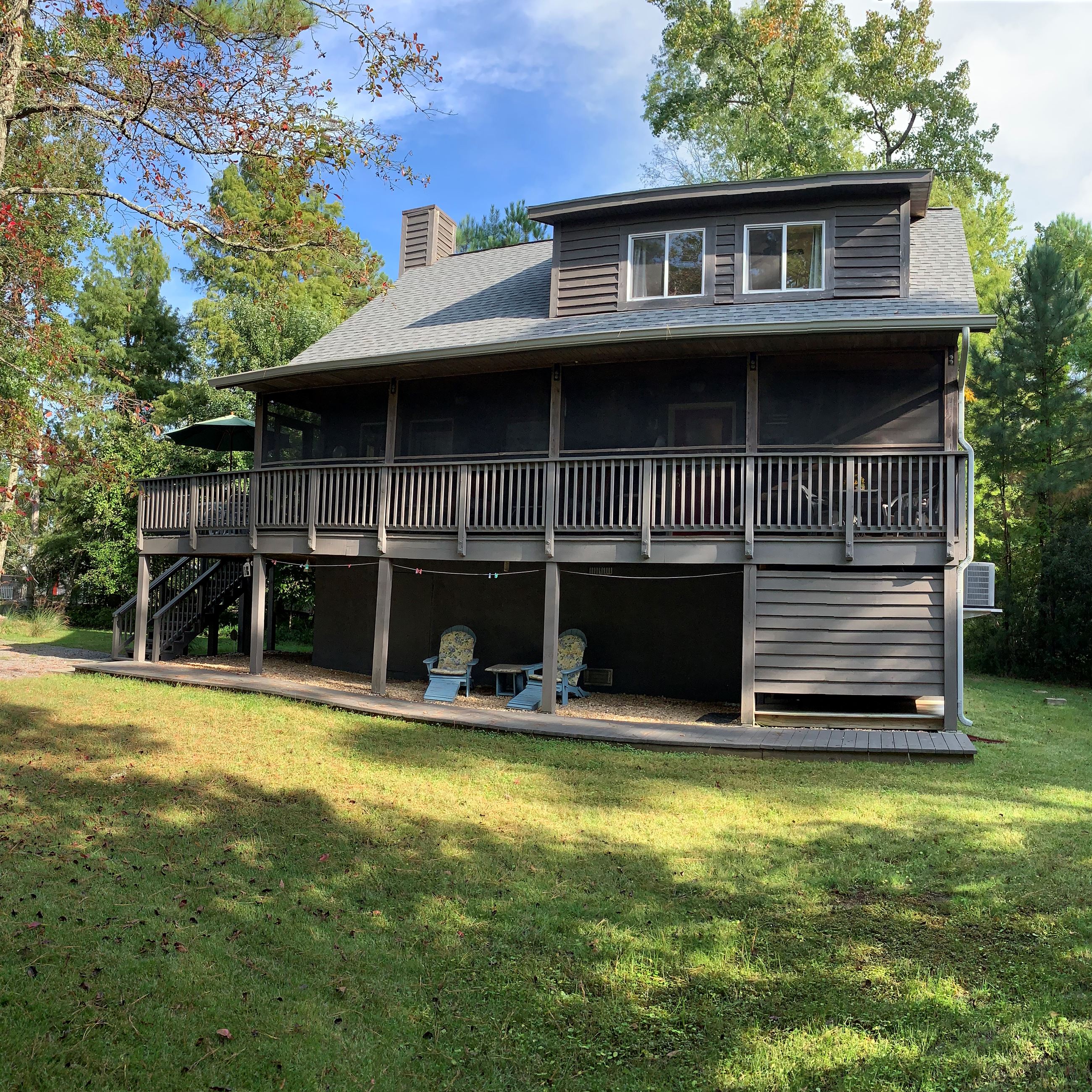 Outside of Cedar Beach Lodge surrounded by trees