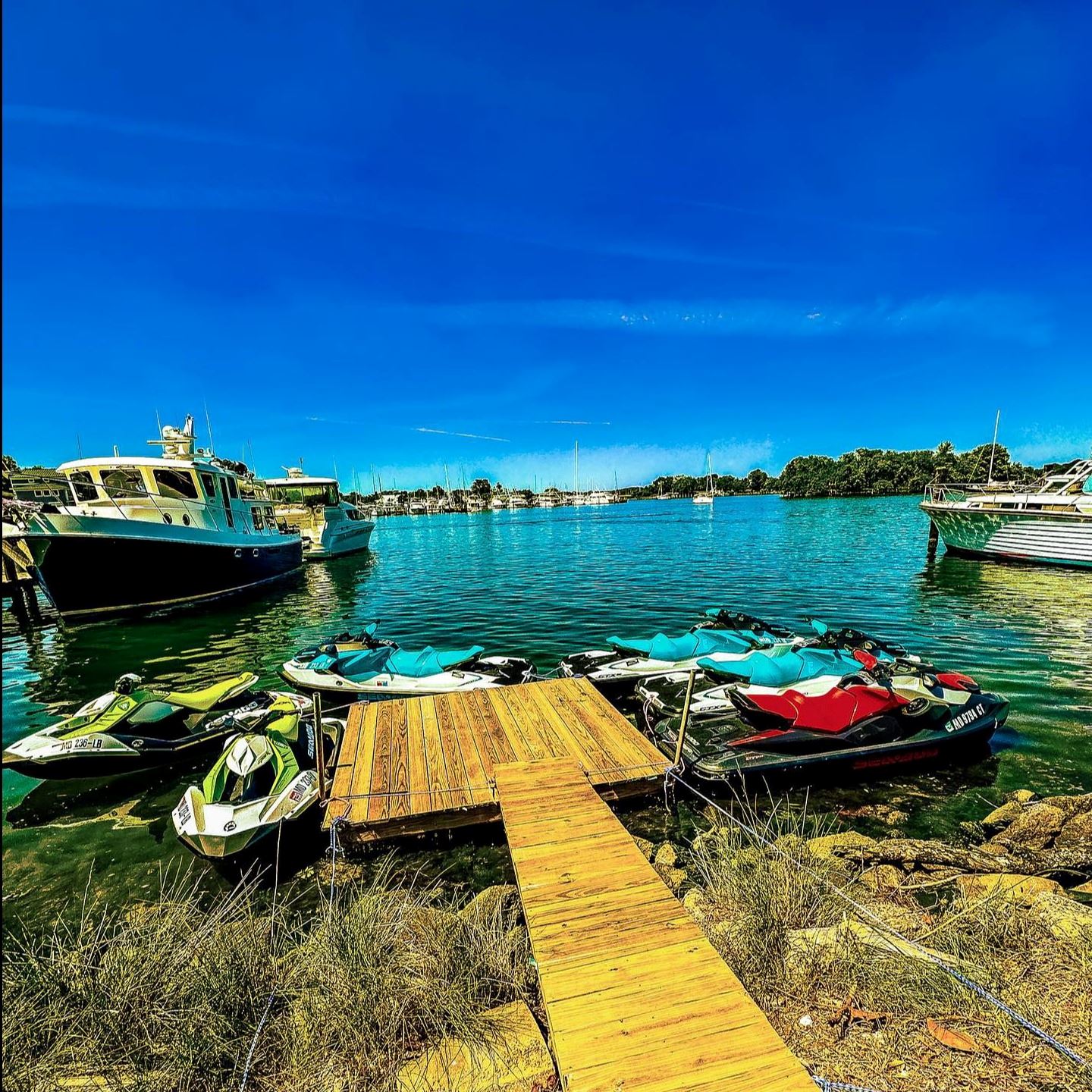 water skis in the water by a wooden pier