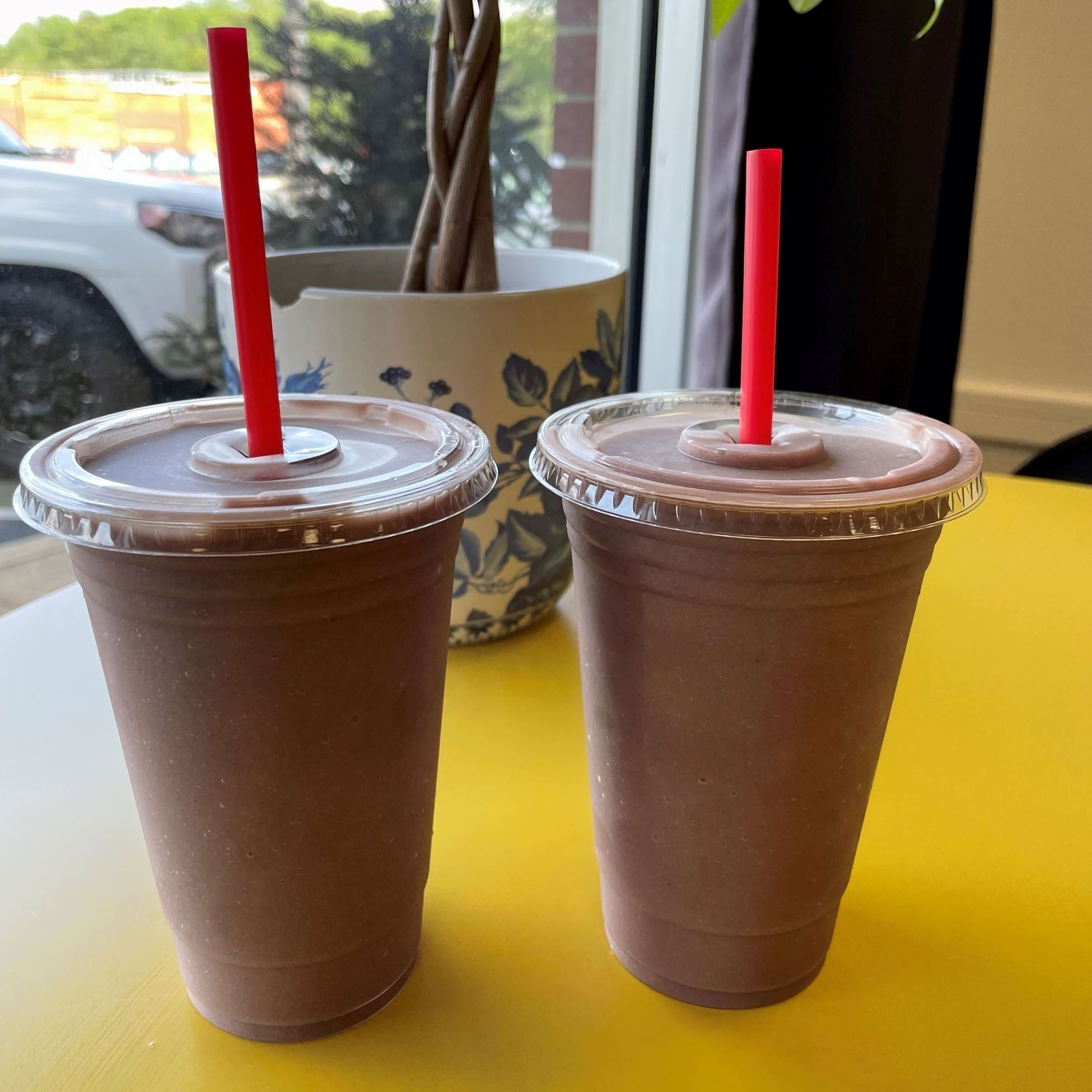 two cups of vegan chocolate smoothies